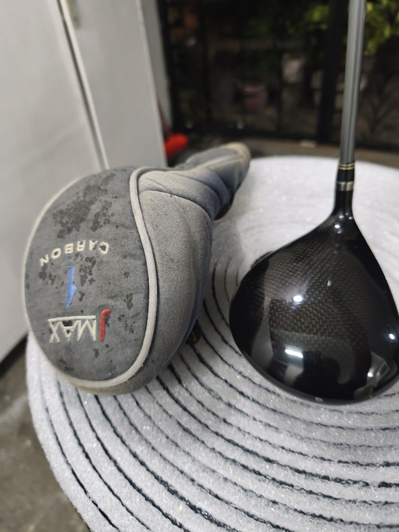 Tour Edge Bazooka JMAX Carbon Driver (Category: Golf) located in Quezon City. Submitted by fancyfootworx (Listing ID 1467710946, Image 1). Description: - Brand/Model: Tour Edge Bazooka JMAX Carbon Golf Driver - Loft & Bias: 10-degree with draw bias - Shaft: Reactive Flex with Regular flex - Includes: Original matching headcover (worn and dirty) - Condition: Noticeable scratches and wear on the sole from regular play - Grip: Intact and ready to pl