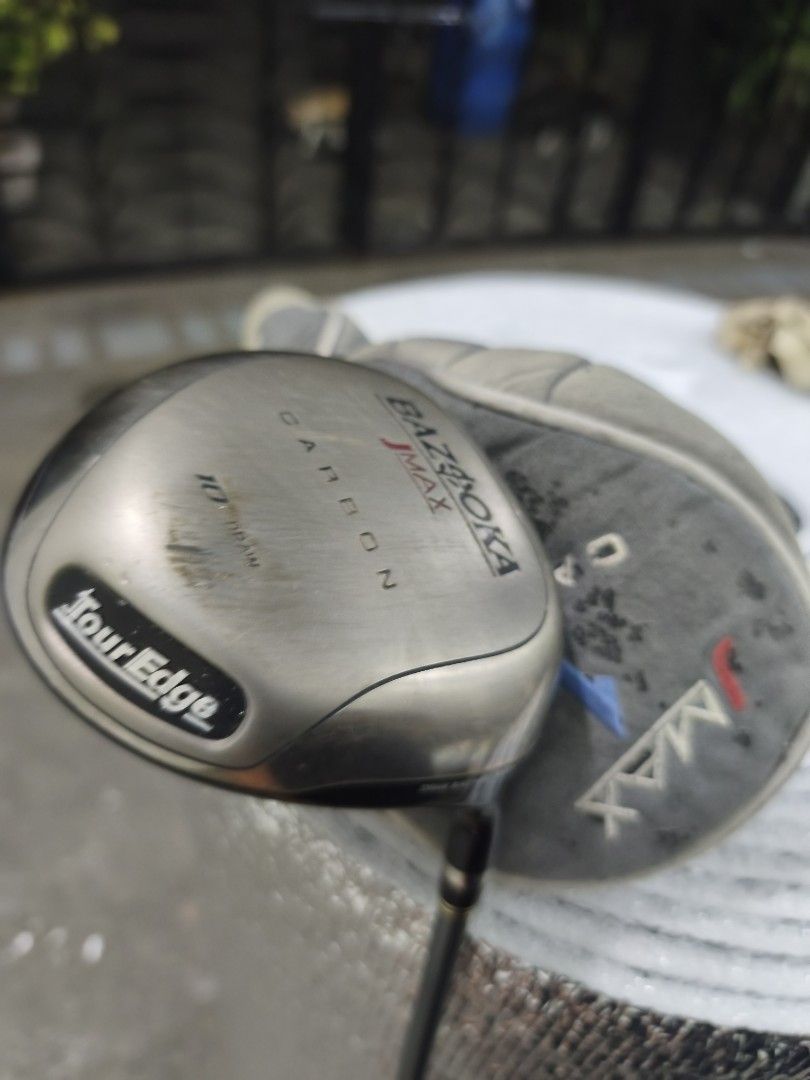 Tour Edge Bazooka JMAX Carbon Driver (Category: Golf) located in Quezon City. Submitted by fancyfootworx (Listing ID 1467710946, Image 3). Description: - Brand/Model: Tour Edge Bazooka JMAX Carbon Golf Driver - Loft & Bias: 10-degree with draw bias - Shaft: Reactive Flex with Regular flex - Includes: Original matching headcover (worn and dirty) - Condition: Noticeable scratches and wear on the sole from regular play - Grip: Intact and ready to pl