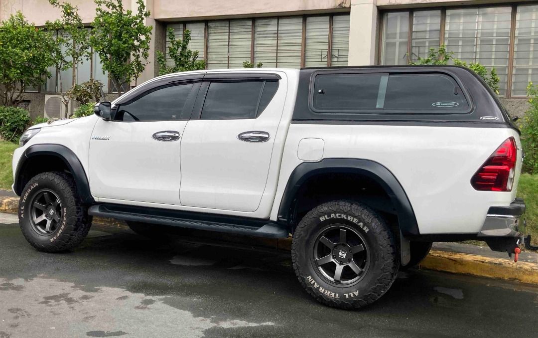 Toyota Hilux Auto (Category: Used Cars) located in Taguig. Submitted by paulvp_s (Listing ID 1467717166, Image 1). Description: Toyota Hilux (Revo) G variant 4x2 Freedom White color 2.4 Turbo Diesel Automatic Transmission 76,000 km mileage Leather seats with embroidered Toyota logo With front and back camera 4-inch lift by Ironman with add a leaf Front shock absorber - Old Man Emu Rear shock absorber - Ironman Black Mamba Mags Black Bear All Terr
