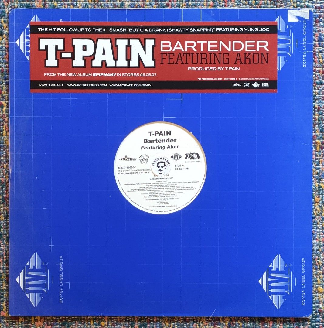 T-Pain - Bartender 12" Vinyl Record (Category: Vinyls) located in Quezon City. Submitted by plaka.o.plomo (Listing ID 1467701187, Image 1). Description: Artist(s) : T-Pain Song(s) : Bartender Year : 2007 Media : VG+ Color : Black Sleeve : Gen No. : 1x Vinyl Size : 12" RPM : 33 Country : US Catalog No. : 88697-10908-1 Tracklist : - Side A 1. Clean 4:01 2. Instrumental 4:00 - Side B 1. Main 4:01 2. Dirty Acappella 3:56 Notes : Sticker on record lab