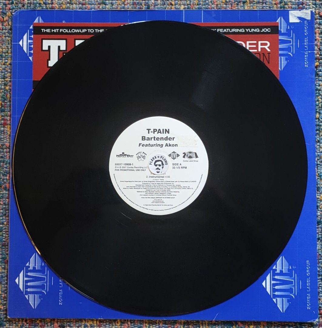 T-Pain - Bartender 12" Vinyl Record (Category: Vinyls) located in Quezon City. Submitted by plaka.o.plomo (Listing ID 1467701187, Image 3). Description: Artist(s) : T-Pain Song(s) : Bartender Year : 2007 Media : VG+ Color : Black Sleeve : Gen No. : 1x Vinyl Size : 12" RPM : 33 Country : US Catalog No. : 88697-10908-1 Tracklist : - Side A 1. Clean 4:01 2. Instrumental 4:00 - Side B 1. Main 4:01 2. Dirty Acappella 3:56 Notes : Sticker on record lab