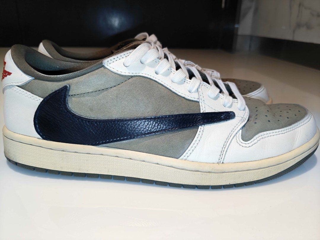 Travis Scott x Air Jordan 1 Low Medium Olive (Category: Sneakers) located in Manila. Submitted by pam.pam4 (Listing ID 1467661443, Image 3). Description: - Model: Travis Scott Collaboration Sneakers - Colorway: Medium Olive / Sail / Black - Size: US 11 Men's - Design details: Reverse black leather swoosh, white leather overlays, olive green suede base, sail midsole, red Nike Air tongue branding, and Cactus Jack heel/insole logos - Inclusions: Reg