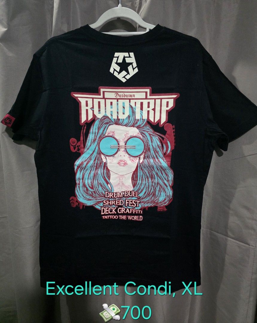 Tribal Road Trip XL (Category: Tshirts & Polo Shirts ) located in Santa Rosa. Submitted by rowhell09 (Listing ID 1467776630, Image 1). Description: Tribal Roadtrip XL, Excellent Condi 💸700 MOD. LBC MOP. BDO, GCASH LOC. NUEVA ECIJA Meet up. Santa rosa Nueva Ecija - Design: Road Trip graphic (front and back print with blue hair, Drum Duel, and Shred Fest text) - Size: XL - Style: Short sleeves, crew neck - Condition: Brand new, still sealed in ori