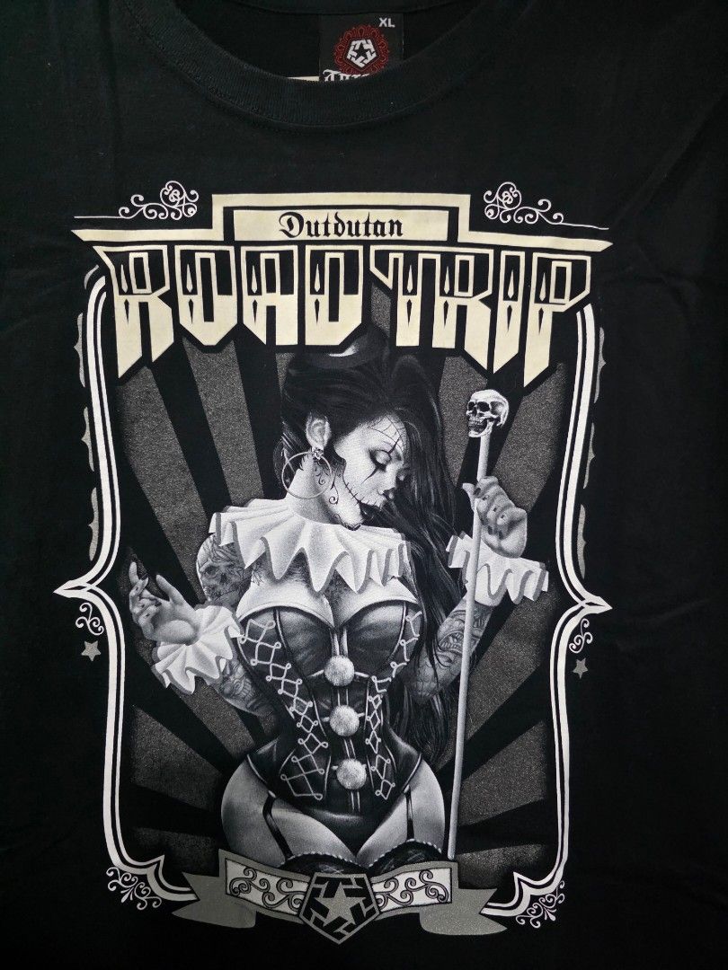 Tribal Road Trip XL (Category: Tshirts & Polo Shirts ) located in Santa Rosa. Submitted by rowhell09 (Listing ID 1467777466, Image 3). Description: Dutdutan Road Trip XL, Excellent Condi 💸700 MOD. LBC MOP. BDO, GCASH LOC. NUEVA ECIJA Meet up. Santa rosa Nueva Ecija - Color: Black - Design: Front features a detailed black & white clown girl holding a skull wand; small tribal star logo near the back collar - Fit: Short sleeves, crew neck - Conditi