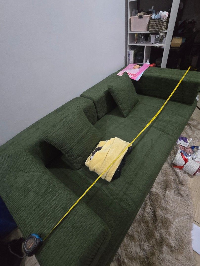 Trikings Corduroy Green Sofa Bed (Category: Sofas) located in Rizal. Submitted by katuski (Listing ID 1467745156, Image 2). Description: - RFS: Wrong Size & too big for my room - got it for 18,851 pesos, now selling it for only 13k (just want to dispose it immediately). price is negotiable - Brand: Trikings - Color: Green (neutral earthy tone) - Type: Corduroy sofa bed - Size: Approx. 200cm long - Features: Soft ribbed fabric, includes back cushi