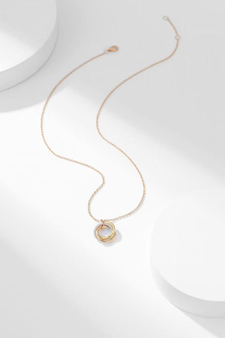 Triple Interlocking Ring Pendant Necklace Rose Gold (Category: Necklaces) located in Navotas City. Submitted by stevensmit50068 (Listing ID 1467673168, Image 2). Description: - Elegant rose gold-tone chain - Features three interlocking pendant rings - One ring beautifully encrusted with clear crystals - Delicate and lightweight design - Secure clasp closure - Perfect minimalist accessory for daily wear.