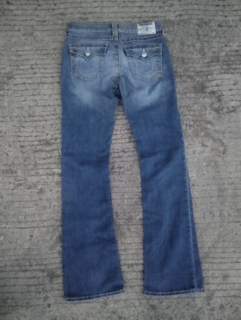 True Religion Boot Cut Jeans Size 28 (Category: Jeans) located in Tacloban City. Submitted by carloibanez225 (Listing ID 1467774527, Image 2). Description: - Brand: True Religion - Style: Boot cut / Y2K vintage look - Color/Wash: Blue wash with distressed fading - Size: 28 (tag inside) - Details: Signature horseshoe flap back pockets, contrast stitching, branded hardware, button closure - Origin: Made in Mexico - Condition: Excellent pre-loved co