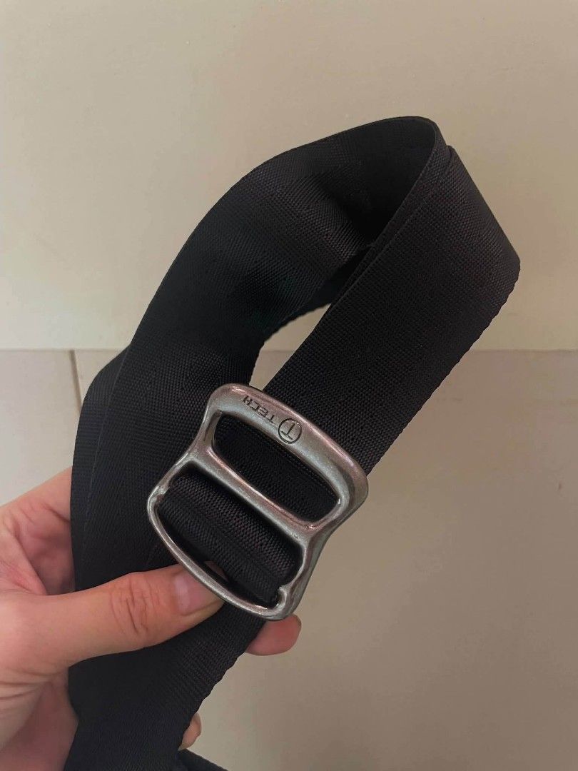 T-Tech black messenger bag (Category: Luxury Bags & Wallets) located in Manila. Submitted by boldfire_315559 (Listing ID 1467641245, Image 2). Description: - Brand: T-Tech - Color: Black - Material: Durable, long-lasting nylon - Strap: Adjustable for a comfortable fit - Hardware: Metal buckle with engraved branding - Pockets: Front zippered pocket with a small hanging charm - Storage: Spacious main compartment ideal for daily carry needs.