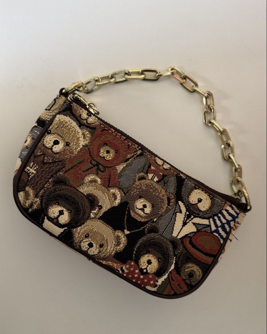 TTWN Bear Two-Way Pochette Bag (Category: Shoulder Bags) located in Las Pinas. Submitted by luxeloveph (Listing ID 1467655784, Image 2). Description: ౨ৎ Material: Canvas ౨ৎ Condition: 8/10 (body is clean just signs of usage on the hardware) ౨ৎ Dimensions: 14 x 5 x 11 cm ౨ৎ Inclusion: leather sling.
