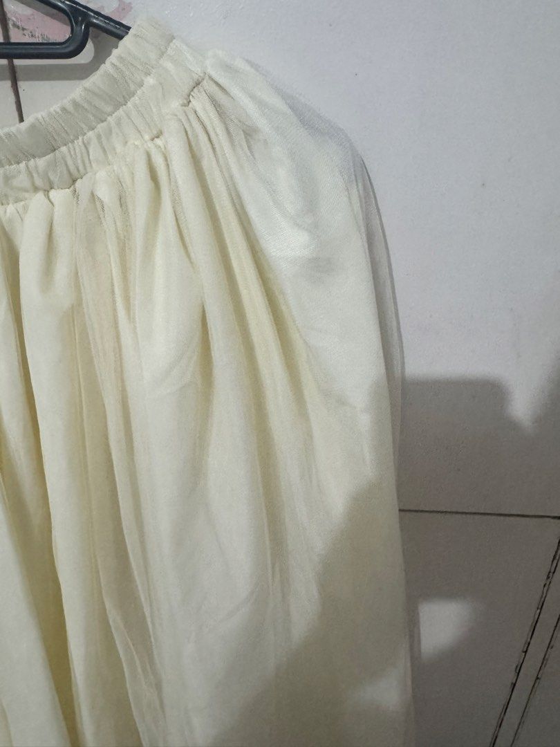 Tulle maxi skirt (Category: Skirts) located in Manila. Submitted by reicellpa20302 (Listing ID 1467744772, Image 2). Description: - Color: Cream white - Length: Ankle length - Fit: Comfy elastic waistband (very stretchy) - Material: Layered mesh fabric with full lining (not see-through) - Style: Full, flowy shape, easy to match with basic tops and sweaters - Occasion: Great for casual day outs or events Rfs: declutterring Gcash/Maribank/Chinabank