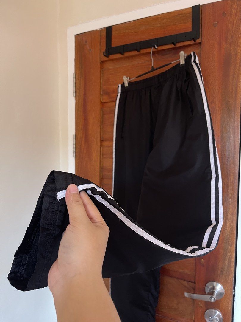 Two lines Track Pants (Category: Other Bottoms) located in Baler. Submitted by declutterwithrhys (Listing ID 1467622394, Image 2). Description: FOR SALE (PLEASE MAKE READING A HABIT) TWO LINES TRACK PANTS WITH DRAWSTRING AND SIDE POCKETS COLOR BLACK WITH WHITE LINES IN EXCELLENT CONDITION COLOR RATE 9/10 CAN FIT SIZE 25 TO 35 WAISTLINE LENGTH 40.5 INCHES UNISEX STRETCHABLE GARTERIZED WAIST WITH MINIMAL FLAWS KINDLY CHECK THE PHOTOS FOR THE COMPLE