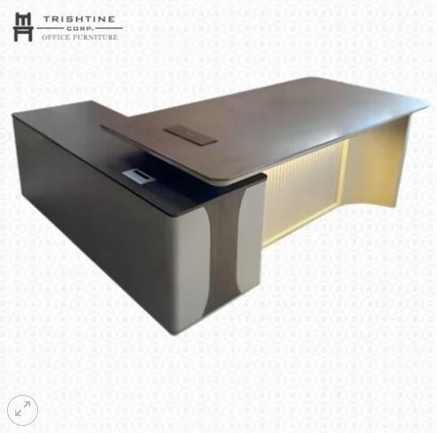 TXT-081 | L-Shape Executive Table (Category: Office Furniture & Fixtures) located in Caloocan City. Submitted by jim.trishtineofficefurnitures (Listing ID 1467659378, Image 1). Description: - Brand/Model: Trishtine Corp L-shaped executive desk - Finish: Dark wood combined with sleek grey and white panels - Storage: Built-in side storage cabinet for clutter-free organization - Power: Integrated power outlets conveniently located on the main surfac