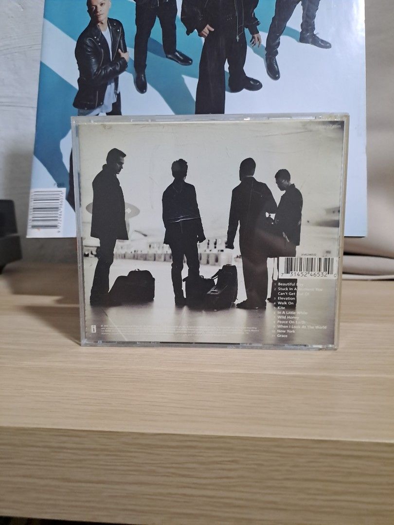 U2 All That You Can't Leave Behind CD (Category: CDs & DVDs) located in Las Pinas. Submitted by cobieshop (Listing ID 1467753559, Image 2). Description: Original U2 album CD, All That You Can't Leave Behind. Plastic jewel case shows standard shelf wear. Tracklist on the back includes Beautiful Day, Elevation, and Walk On. Disc case intact, hinge works fine..