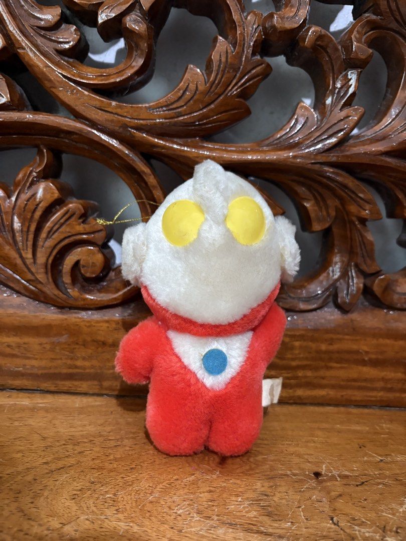 Ultraman plush toy keychain pendant (Category: Plushies & Soft Toys) located in Quezon City. Submitted by rxyel (Listing ID 1467665622, Image 1). Description: - Adorable small Ultraman plush doll with a hanging string - Classic red and white suit design with iconic yellow eyes and blue color timer - Made from soft, high-quality plush fabric - Features an original tag near the bottom back - Perfect accessory for hanging on backpacks, tote bags, or