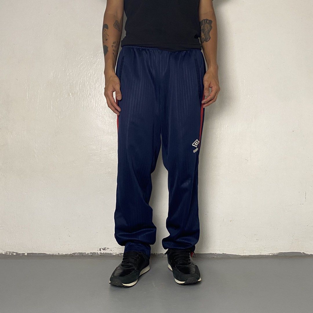 UMBRO 👟| Deep Navy Blue And Red Shadow Stripe Track Pants (Category: Joggers) located in Bulacan. Submitted by orc.ph (Listing ID 1467716916, Image 2). Description: UMBRO 👟| Deep Navy Blue And Red Shadow Stripe Track Pants Material Used: 100% Polyester -Navy Blue -Japan -Elastic Waistband -Internal Adjustable Drawstring -Umbro Embroidered Logo -Straight-Leg Cut -Casual -Streetwear -Zip Ankle -Size: XS-2XL -Waistline: “24-40 -Length: “39.5 -Thig