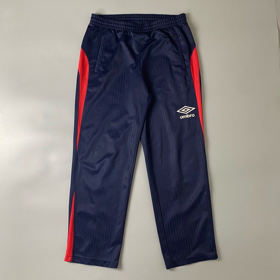 UMBRO 👟| Deep Navy Blue And Red Shadow Stripe Track Pants (Category: Joggers) located in Bulacan. Submitted by orc.ph (Listing ID 1467716916, Image 1). Description: UMBRO 👟| Deep Navy Blue And Red Shadow Stripe Track Pants Material Used: 100% Polyester -Navy Blue -Japan -Elastic Waistband -Internal Adjustable Drawstring -Umbro Embroidered Logo -Straight-Leg Cut -Casual -Streetwear -Zip Ankle -Size: XS-2XL -Waistline: “24-40 -Length: “39.5 -Thig