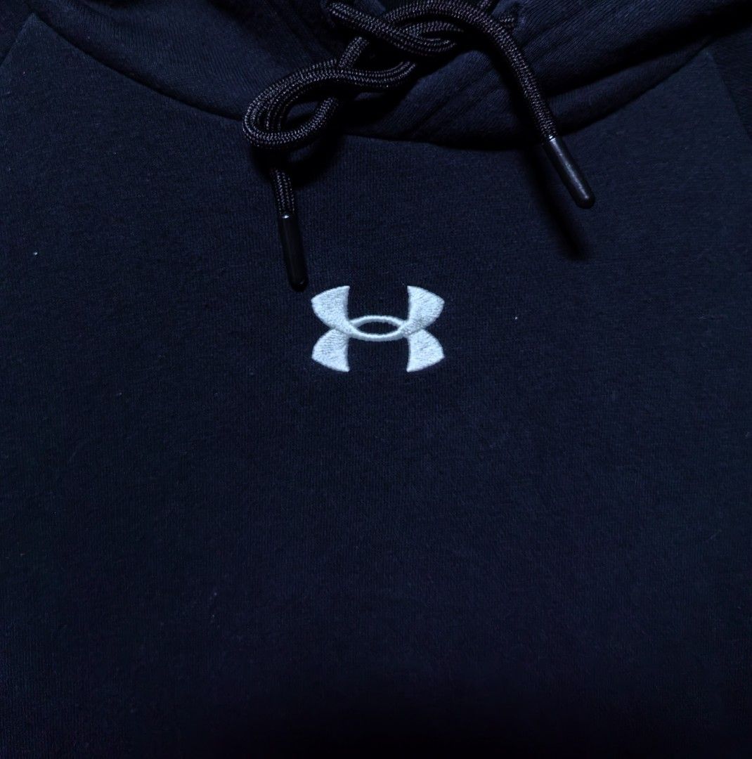 Under Armour Black Hoodie LG (Category: Hoodies) located in Quezon. Submitted by miksxthrift (Listing ID 1467740585, Image 2). Description: - Brand: Under Armour - Color: Black with white embroidered chest logo - Size: Large (Relaxed fit) - Material: Comfortable fleece interior - Features: Front kangaroo pocket, adjustable drawstring hood - Origin: Made in the Philippines - Condition: Ideal for casual days and workouts.