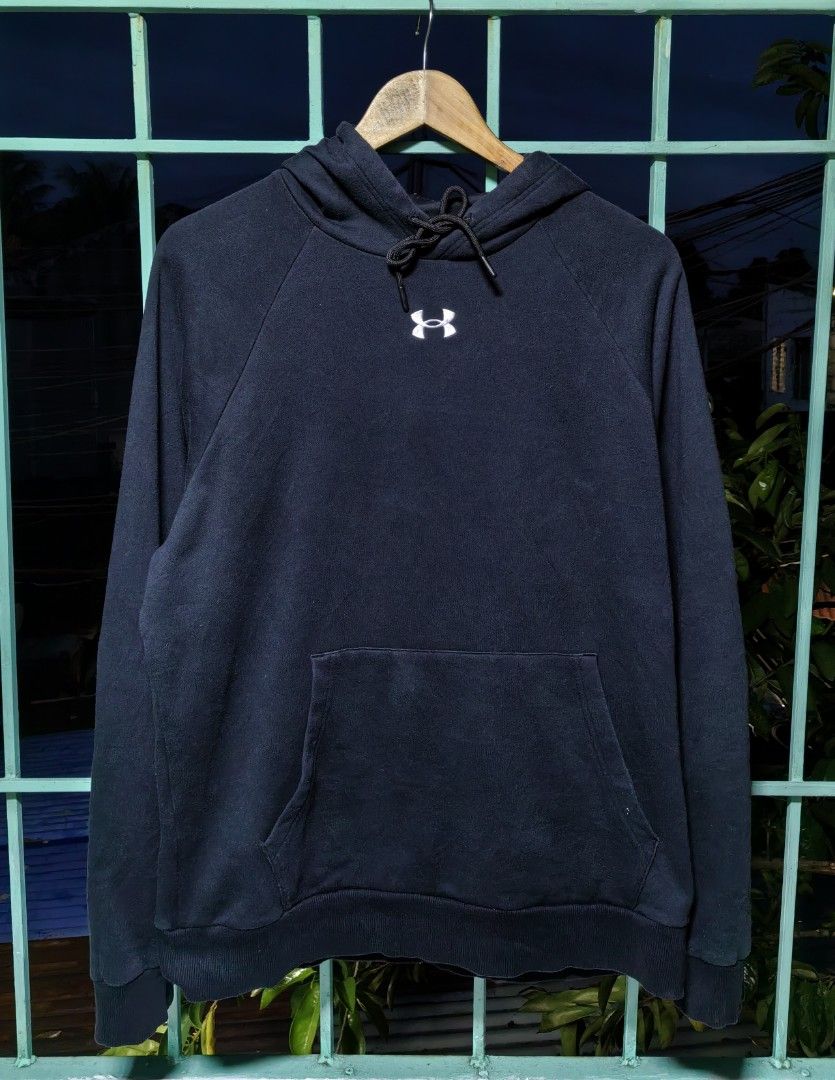 Under Armour Black Hoodie LG (Category: Hoodies) located in Quezon. Submitted by miksxthrift (Listing ID 1467740585, Image 1). Description: - Brand: Under Armour - Color: Black with white embroidered chest logo - Size: Large (Relaxed fit) - Material: Comfortable fleece interior - Features: Front kangaroo pocket, adjustable drawstring hood - Origin: Made in the Philippines - Condition: Ideal for casual days and workouts.