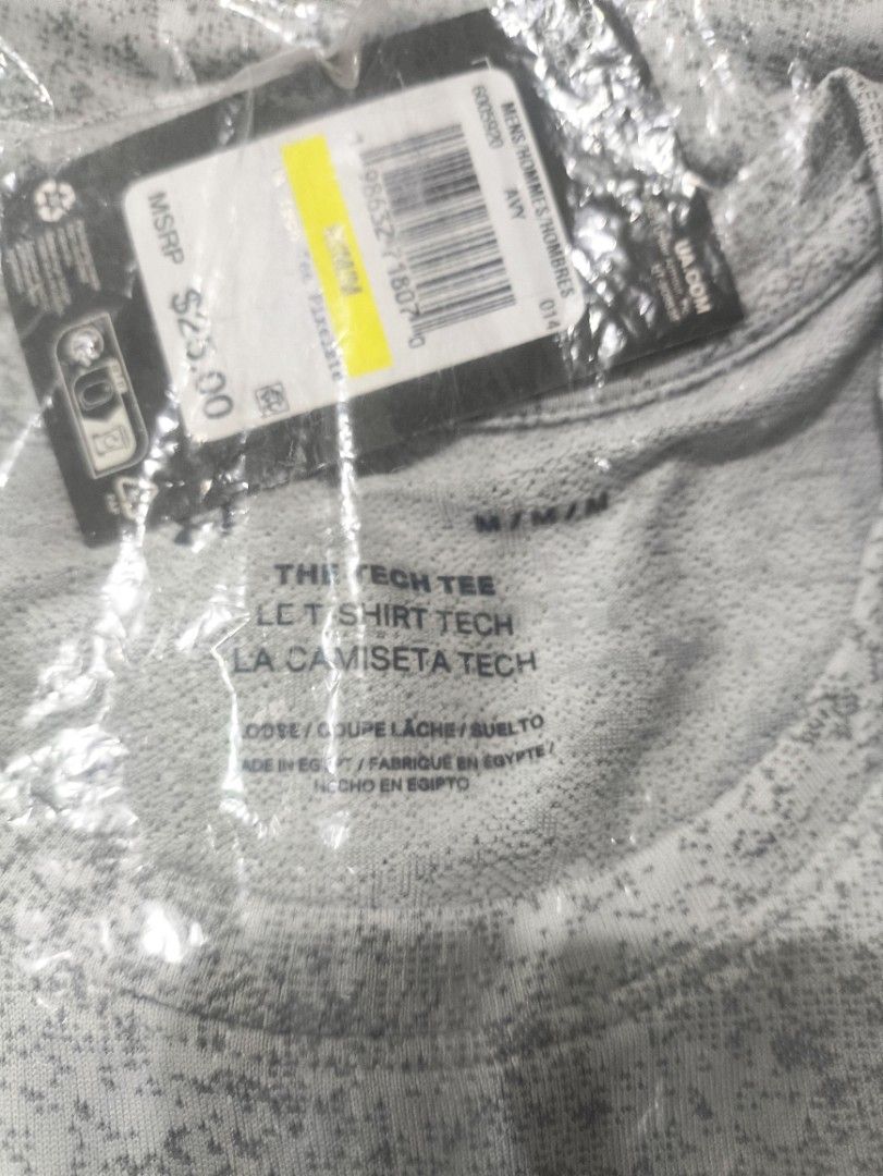 Under Armour Men's Tech Tee Pixelate Grey (Category: Tshirts & Polo Shirts ) located in Rizal. Submitted by youngwolf-5f02 (Listing ID 1467689587, Image 2). Description: - Brand: Under Armour - Item: Tech Tee - Color/Pattern: Grey Pixelate Print - Size: Men's Medium (Loose Fit) - Design: Short sleeves, crew neck, large front logo graphic - Condition: Brand new with original tags, still sealed in plastic packaging - Retail Price: $25.