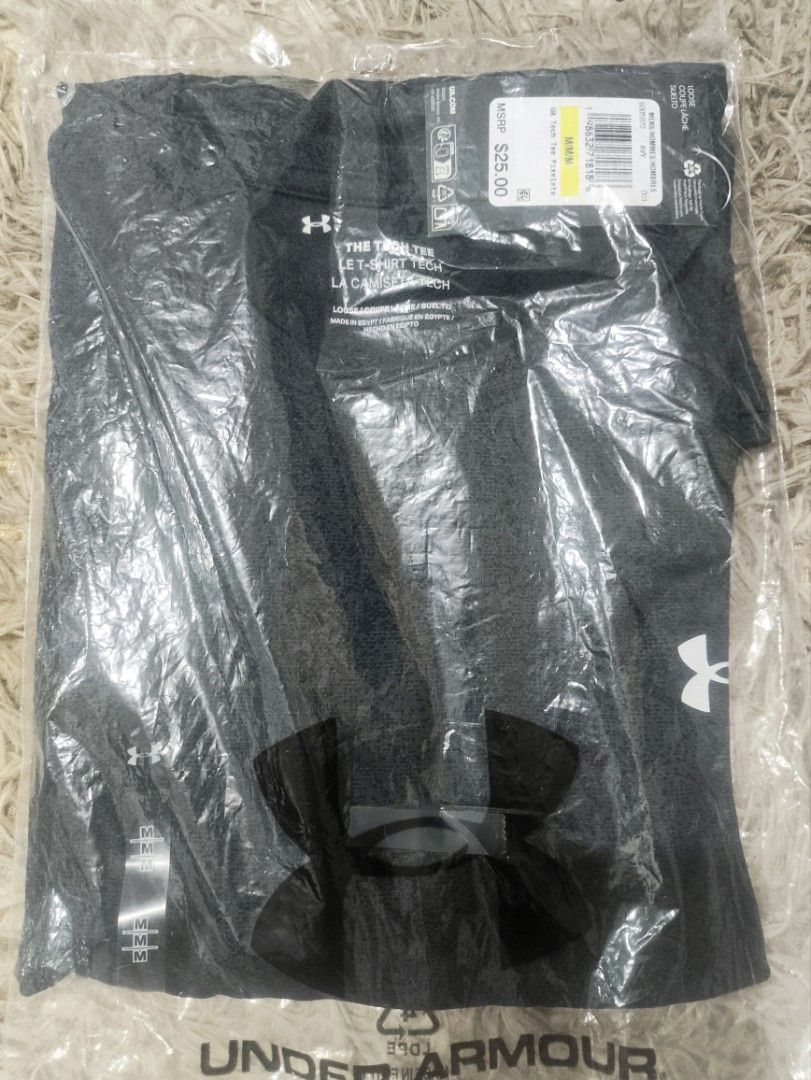 Under Armour Men's Tech Tee Size M Grey (Category: Activewear) located in Rizal. Submitted by youngwolf-5f02 (Listing ID 1467689243, Image 1). Description: - Brand: Under Armour - Item: Men's Tech Tee - Color: Grey - Size: Medium (Loose Fit) - Sleeve: Short Sleeve - Design: Large UA logo on chest - Condition: Brand new with tags in original packaging - MSRP: $25 - Origin: Made in Egypt.