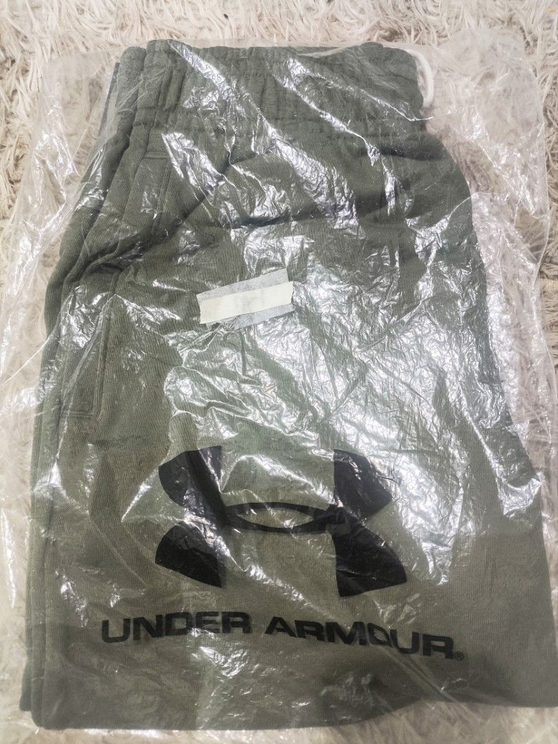 Under Armour Rival Terry Shorts (Category: Shorts) located in Rizal. Submitted by youngwolf-5f02 (Listing ID 1467690079, Image 1). Description: - Brand: Under Armour Rival Terry Shorts - Color: Army Green - Size: S/CH - Condition: Brand new, sealed in original plastic packaging with retail tags attached - Features: Drawstring waist, iconic black UA logo on the leg - Retail Price: $45.00.