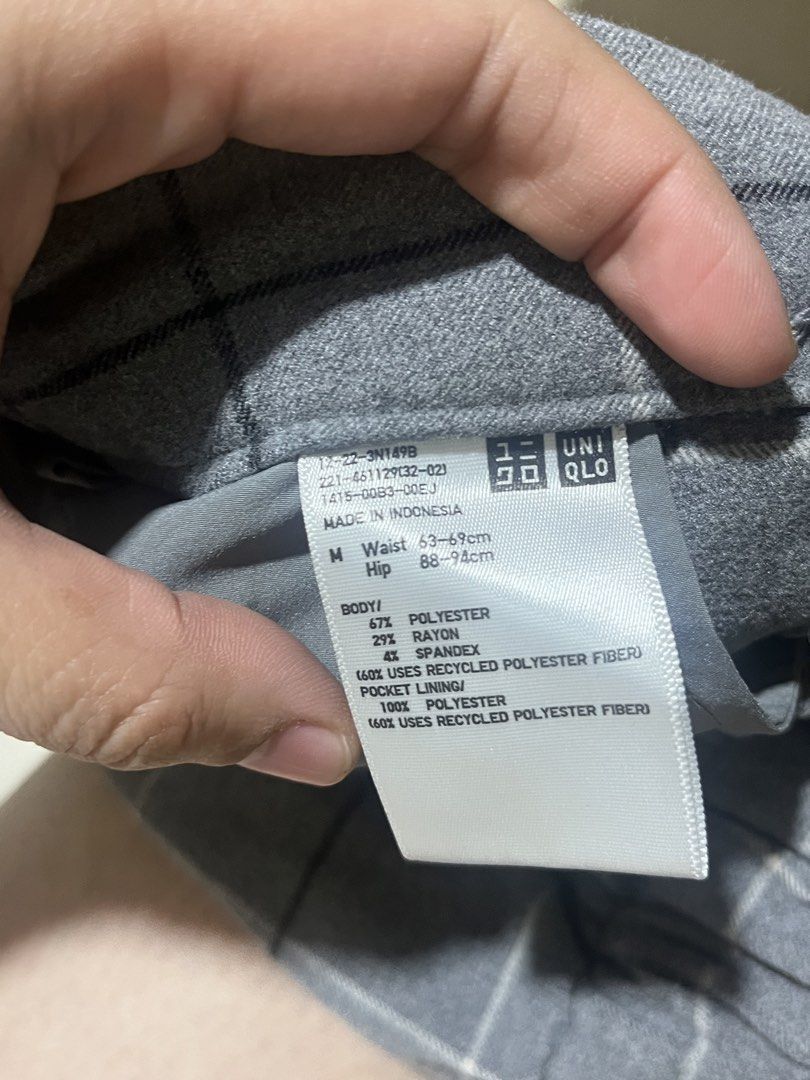 Uniqlo Grey Checked Windowpane Skorts Size M (Category: Skirts) located in Manila. Submitted by bleoniz (Listing ID 1467826808, Image 3). Description: - Brand: Uniqlo - Item: Windowpane check skorts (wrap skirt front with hidden shorts underneath) - Color: Grey with black and white check pattern - Size: M (fits waist 63-69cm, hips 88-94cm) - Material: Polyester, rayon, and spandex blend - Features: Elastic back waistband for comfort, side button 