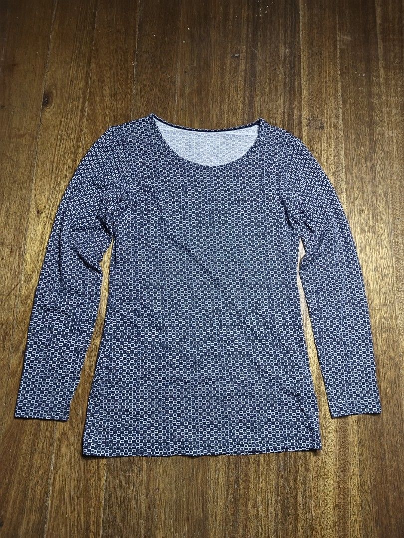 Uniqlo Heattech medium women's (Category: Longsleeves) located in Mandaluyong City. Submitted by heatgear (Listing ID 1467748092, Image 1). Description: - Brand: Uniqlo Heattech - Style: Long sleeve top with scoop neckline and all-over geometric square pattern - Color: Dark blue base with white print - Size: Tagged M (fits bust 80-86cm) - Material: 39% polyester, 34% acrylic, 18% rayon, 9% polyurethane - Condition/Features: Warm thermal layer, gr