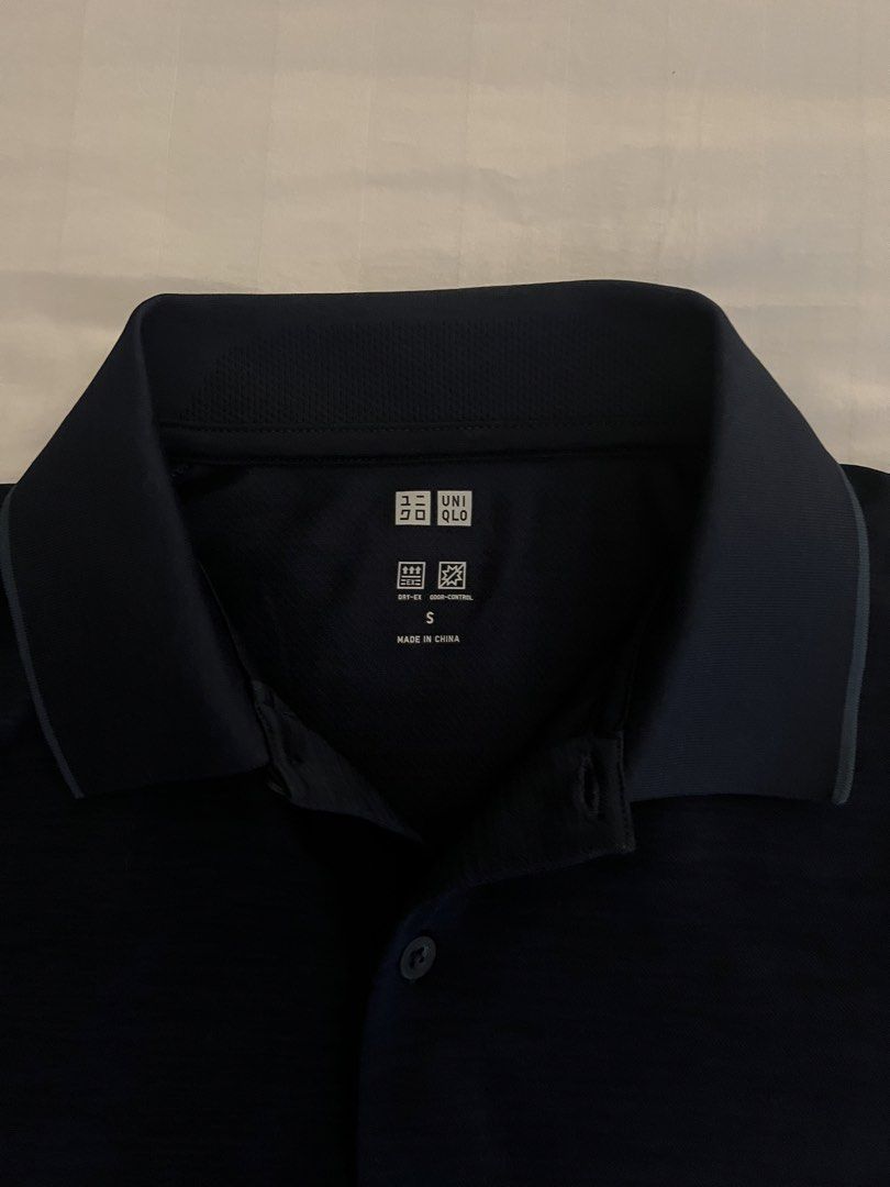Uniqlo Men’s Shirt (Category: Activewear) located in Quezon City. Submitted by inthefrow (Listing ID 1467701611, Image 2). Description: - Preloved - In navy blue - Grey accent color on the collar - Dri-ex - odor-control • Best price already .