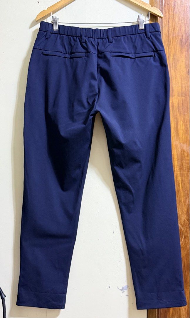 Uniqlo Navy Blue Ultra Stretch Active Pants Drawstring Size M (Category: Joggers) located in Paete. Submitted by skydruemadison (Listing ID 1467737524, Image 3). Description: - Brand: Uniqlo - Color: Navy blue - Condition: Clean with tags intact - Waist: Elastic with drawstring and belt loops - Pockets: Deep side pockets and zippered back pockets with mesh lining - Material: Lightweight stretch fabric - Versatile for workouts, travel, or casual w