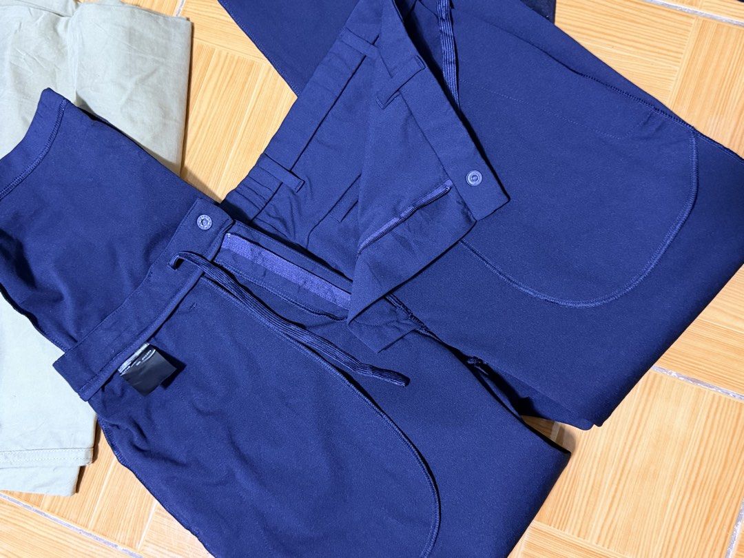 Uniqlo Navy Blue Ultra Stretch Active Pants Drawstring Size M (Category: Joggers) located in Paete. Submitted by skydruemadison (Listing ID 1467737524, Image 2). Description: - Brand: Uniqlo - Color: Navy blue - Condition: Clean with tags intact - Waist: Elastic with drawstring and belt loops - Pockets: Deep side pockets and zippered back pockets with mesh lining - Material: Lightweight stretch fabric - Versatile for workouts, travel, or casual w