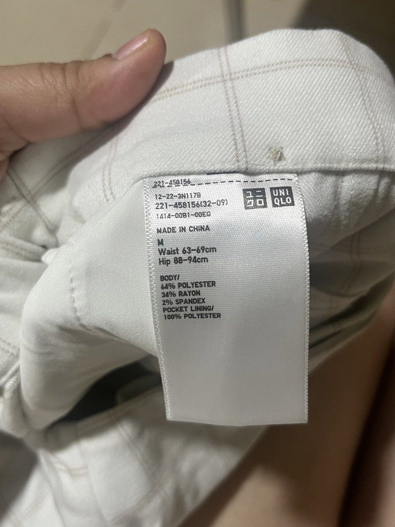 Uniqlo Plaid Wrap Skort Size M (Category: Skirts) located in Manila. Submitted by bleoniz (Listing ID 1467826850, Image 3). Description: Uniqlo plaid skirt-shorts hybrid in size M. White fabric with thin grey checked lines. Wrap front design secured with a single button, elastic back waistband for easy fit. Material is 64 percent polyester, 34 percent rayon, 2 percent spandex. Waist fits 63 to 69 cm, hips fit 88 to 94 cm..