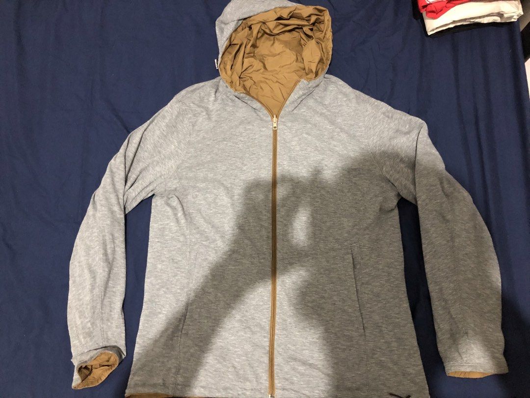 Uniqlo Reversible Brown Grey Hooded Jacket (Category: Coats, Jackets and Outerwear) located in Manila. Submitted by janmichael26601 (Listing ID 1467698509, Image 3). Description: - Two-way design in brown and heather grey - Full zip closure up the front - Attached hood with adjustable drawstrings - Lightweight fabric, ideal for layering - Standard slip pockets on both sides.