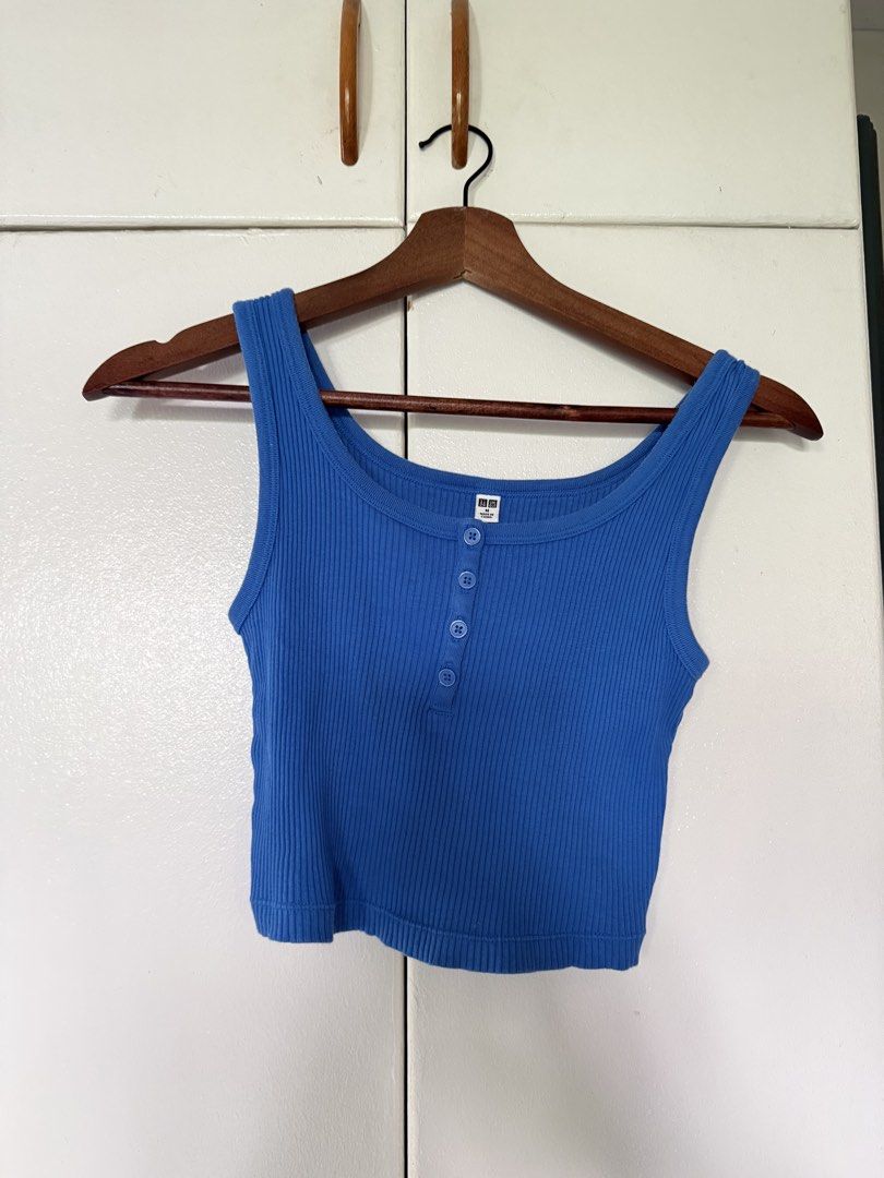 Uniqlo Ribbed Button-Up Tops Bundle (Category: Blouses) located in Iloilo. Submitted by trixiaaa18 (Listing ID 1467625276, Image 2). Description: - Brand: Uniqlo - Size: M - Bundle includes: 1 blue sleeveless tank top and 1 dark navy short sleeve tee and 1 button up crop top - Material: Soft, stretchable ribbed fabric.