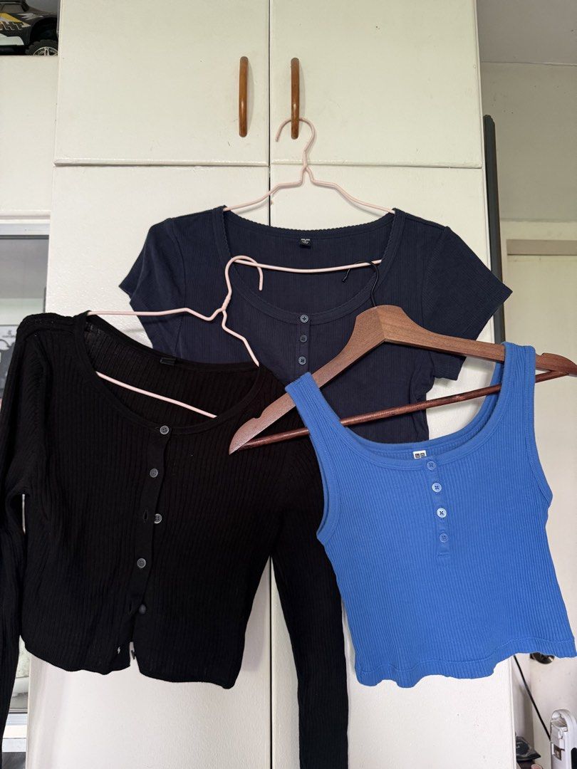 Uniqlo Ribbed Button-Up Tops Bundle (Category: Blouses) located in Iloilo. Submitted by trixiaaa18 (Listing ID 1467625276, Image 1). Description: - Brand: Uniqlo - Size: M - Bundle includes: 1 blue sleeveless tank top and 1 dark navy short sleeve tee and 1 button up crop top - Material: Soft, stretchable ribbed fabric.