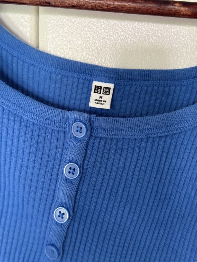 Uniqlo Ribbed Button-Up Tops Bundle (Category: Blouses) located in Iloilo. Submitted by trixiaaa18 (Listing ID 1467625276, Image 3). Description: - Brand: Uniqlo - Size: M - Bundle includes: 1 blue sleeveless tank top and 1 dark navy short sleeve tee and 1 button up crop top - Material: Soft, stretchable ribbed fabric.