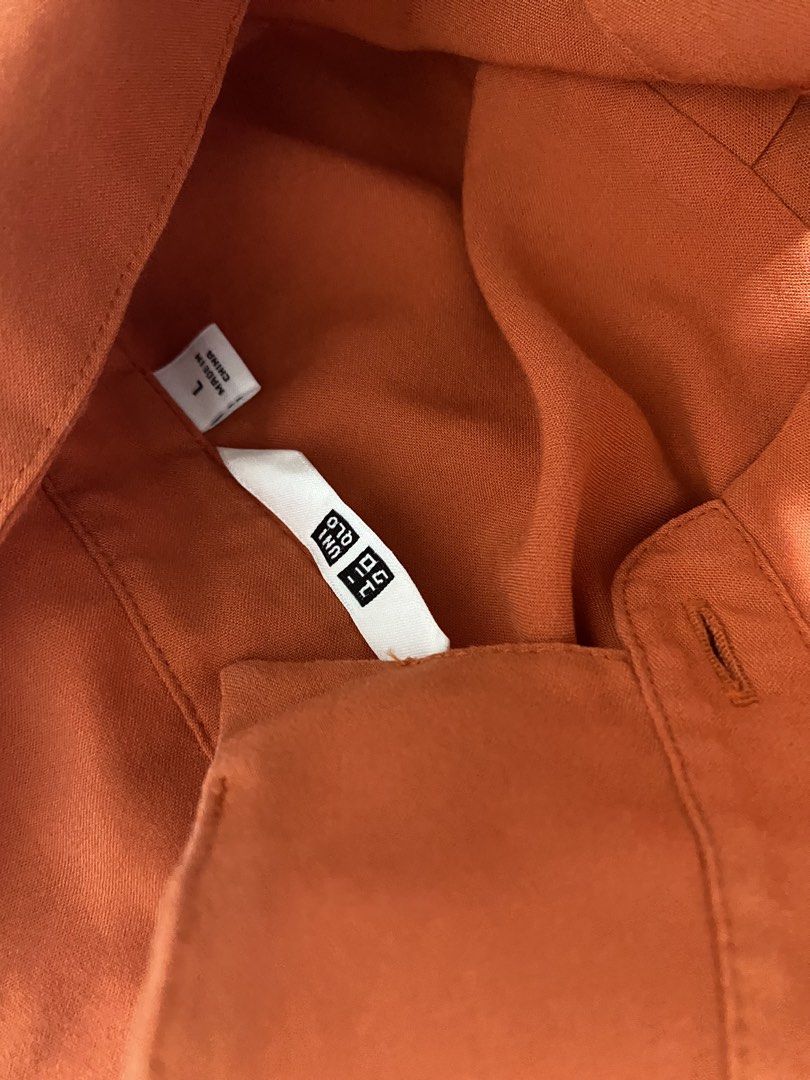 Uniqlo Rust Orange Sleeveless Button-Up Blouse Size L (Category: Sleeveless) located in Cabanatuan. Submitted by ashramtobi29604 (Listing ID 1467724660, Image 3). Description: - Brand: Uniqlo - Style: Sleeveless button-up with classic collar - Color: Rust orange - Size: L (Made in China) - Material: Lightweight and breathable - Condition: Excellent, ideal for layering or warm days Color rate 9/10 almost new.