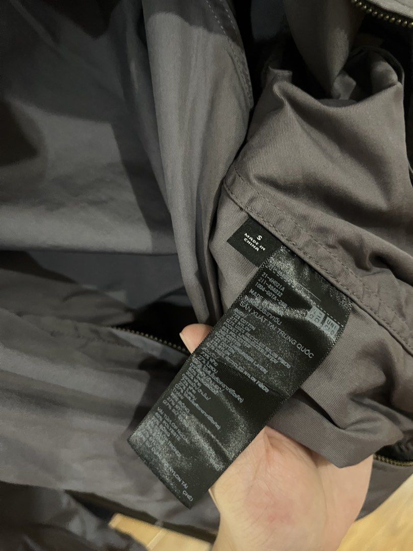 Uniqlo U Gray Zip Jacket Size S (Category: Coats, Jackets and Outerwear) located in Makati City. Submitted by grizzlybear95 (Listing ID 1467730360, Image 3). Description: - Brand: Uniqlo U - Item: Zip Jacket - Color: Dark Gray - Size: Small (S) - Material: Cotton and nylon blend - Design: Front zipper closure, stand collar, raglan sleeves, and side pockets - Origin: Made in China - Condition: Clean inside and out, well-maintained.