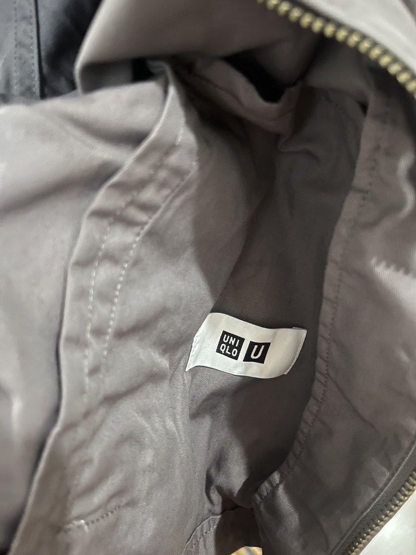 Uniqlo U Gray Zip Jacket Size S (Category: Coats, Jackets and Outerwear) located in Makati City. Submitted by grizzlybear95 (Listing ID 1467730360, Image 2). Description: - Brand: Uniqlo U - Item: Zip Jacket - Color: Dark Gray - Size: Small (S) - Material: Cotton and nylon blend - Design: Front zipper closure, stand collar, raglan sleeves, and side pockets - Origin: Made in China - Condition: Clean inside and out, well-maintained.