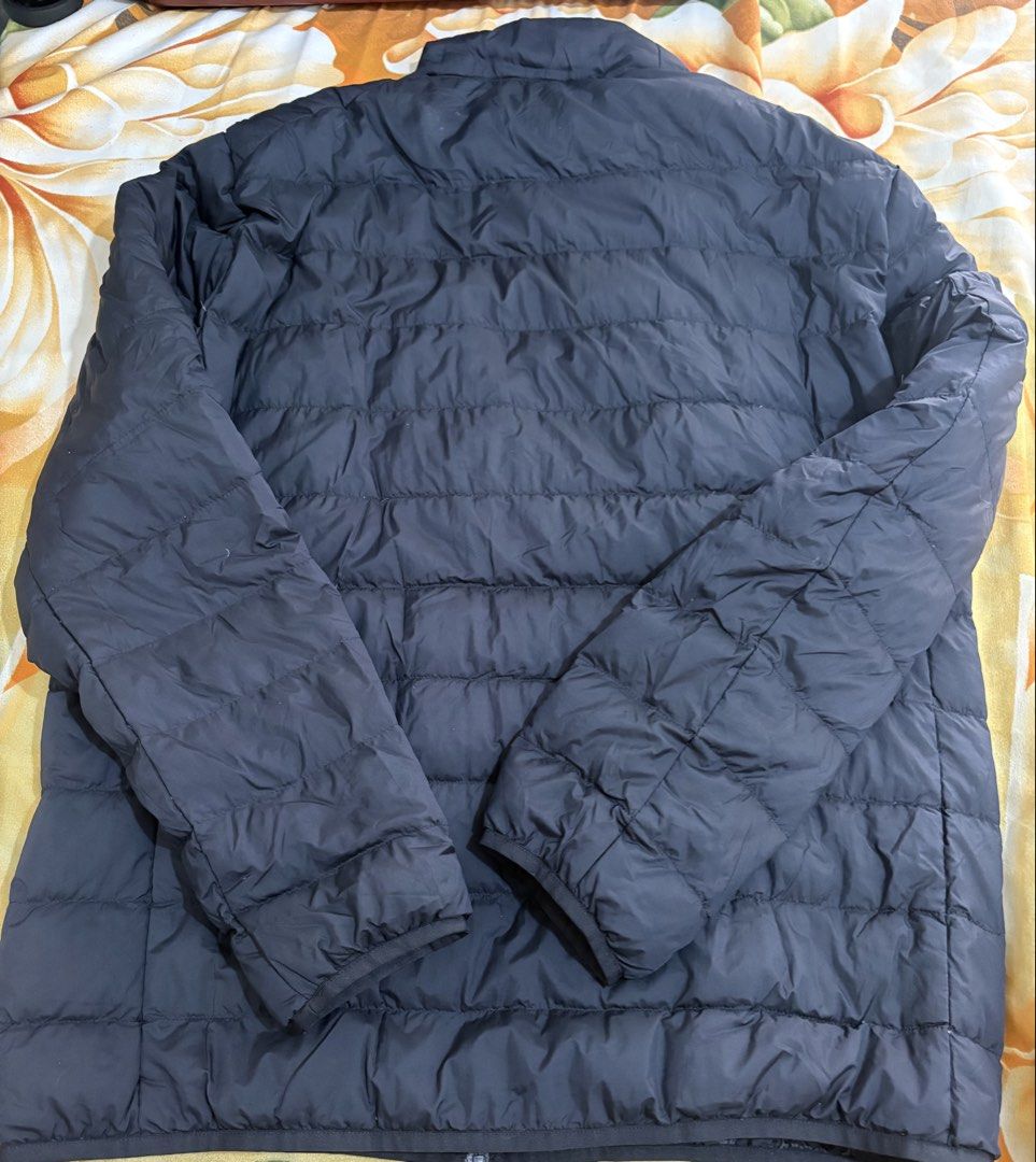 Uniqlo Ultra Light Down Jacket Size L (Category: Coats, Jackets and Outerwear) located in Manila. Submitted by bry0824 (Listing ID 1467617467, Image 3). Description: For sale: Uniqlo Ultra Light Down Jacket Large Price: 2800 Original from uniqlo. Size L. Complete with pouch. With durable water repellency. Never been used. Na-stock lang. No hood, high collar type. RFS: Maliit na sakin / Hindi nagagamit. 📍Location: QC Meet up: WalterMart Junction 