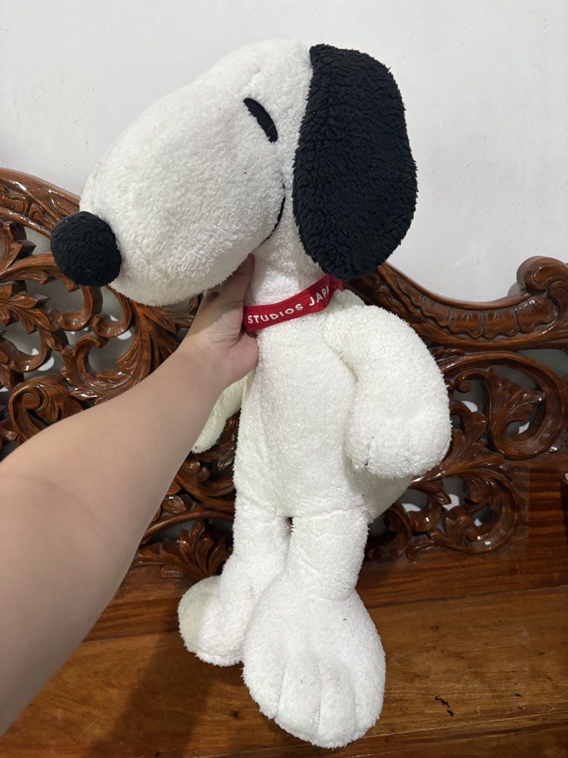 Universal Studios Japan Snoopy Plush Toy (Category: Plushies & Soft Toys) located in Quezon City. Submitted by rxyel (Listing ID 1467665445, Image 2). Description: - Authentic Universal Studios Japan (USJ) large Snoopy plush toy - Features soft white fleece body with classic black ears and nose - Wears an official red collar reading 'Studios Japan' - Comes with original official tag attached on the back - Condition note: Has a small brown spot on