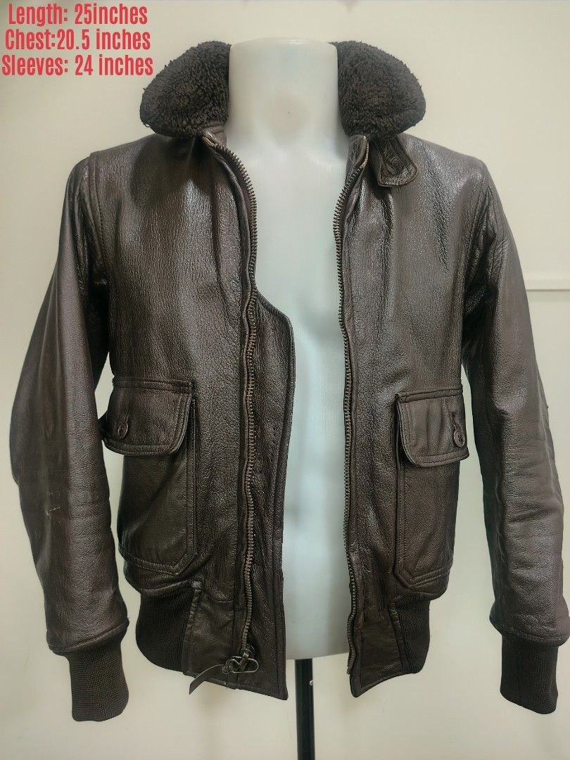 USN Vintage Brown Leather Bomber Jacket with Shearling Collar (Category: Coats, Jackets and Outerwear) located in La Trinidad. Submitted by padasem_kadi (Listing ID 1467643416, Image 1). Description: - Color/Material: Supple dark brown leather with a nice grain texture - Collar: Cozy faux shearling - Hardware: Heavy-duty front Scovill zipper - Features: Ribbed cuffs and hem to block the wind, plus two large button-flap front pockets - Measurement