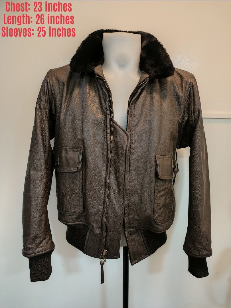 USN Vintage Brown Leather Bomber Jacket (Category: Coats, Jackets and Outerwear) located in La Trinidad. Submitted by padasem_kadi (Listing ID 1467644714, Image 1). Description: - Material: Genuine brown leather with natural texture and grain - Collar: Contrast black fur collar - Closure: Heavy-duty Scovill front zipper - Pockets: Two front flap pockets with button closure - Details: Ribbed cuffs and hem for a classic bomber fit - Measurements: 2