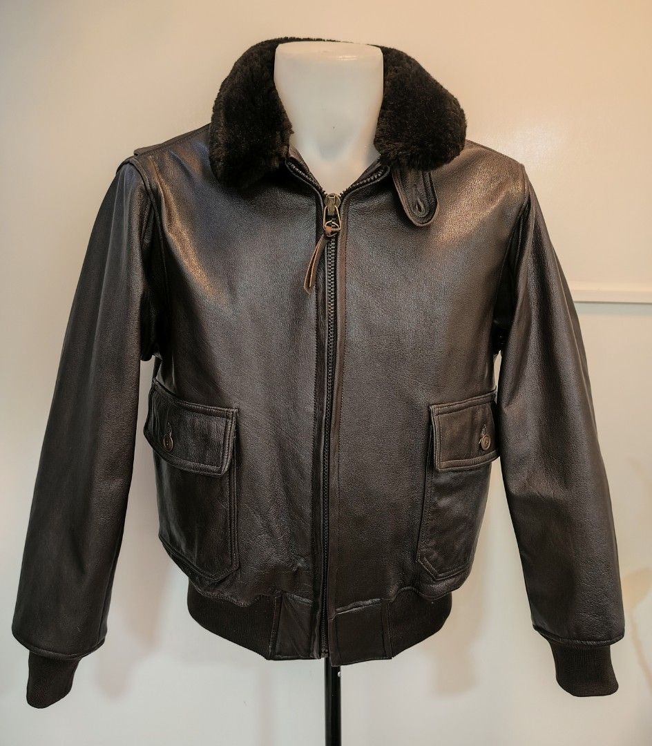 USN Vintage Leather Bomber Jacket (Category: Coats, Jackets and Outerwear) located in La Trinidad. Submitted by padasem_kadi (Listing ID 1467644271, Image 3). Description: - Color: Dark brown - Material: Classic leather with soft black faux fur collar - Closure: Sturdy metal zipper - Pockets: Convenient front flap pockets - Details: Ribbed cuffs and hem to block the wind - Measurements: Chest 24" | Length 26" | Sleeves 24" - Condition: Great qual