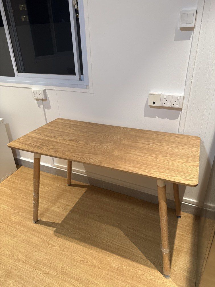 Utility wooden table (Category: Tables & Sets) located in Singapore. Submitted by olplsg (Listing ID 1467738708, Image 1). Description: Well used utility table Can be used for dining, side table, many uses. Still in relatively good condition Add chair for 2 dollars each if you need .