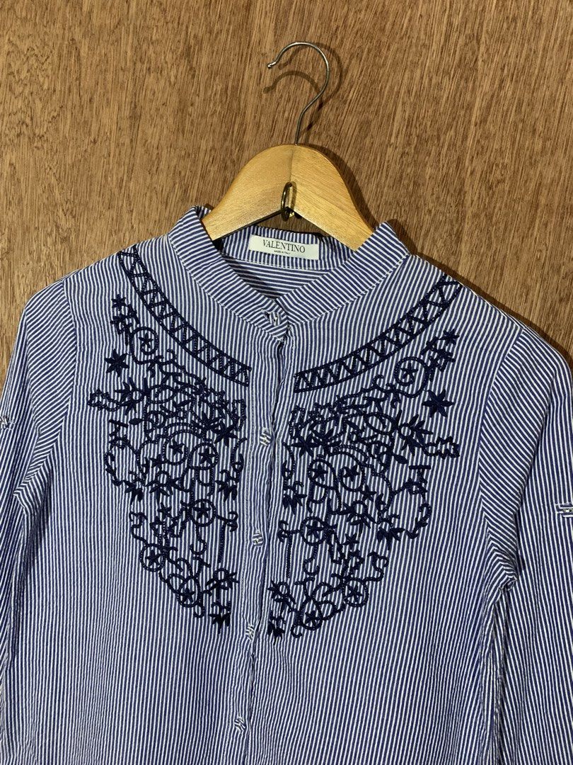 Valentino Blue Striped Embroidered Button-Down Shirt (Category: Formal Shirts) located in Tacurong. Submitted by ljsthrift (Listing ID 1467603760, Image 2). Description: - Valentino button-down shirt in blue & white stripes - Features a chic mandarin collar and intricate dark blue embroidery across the chest and neckline - Made of lightweight, premium cotton (Made in Italy, produced in Hungary) - Clean neckline label and inner care tag fully inta
