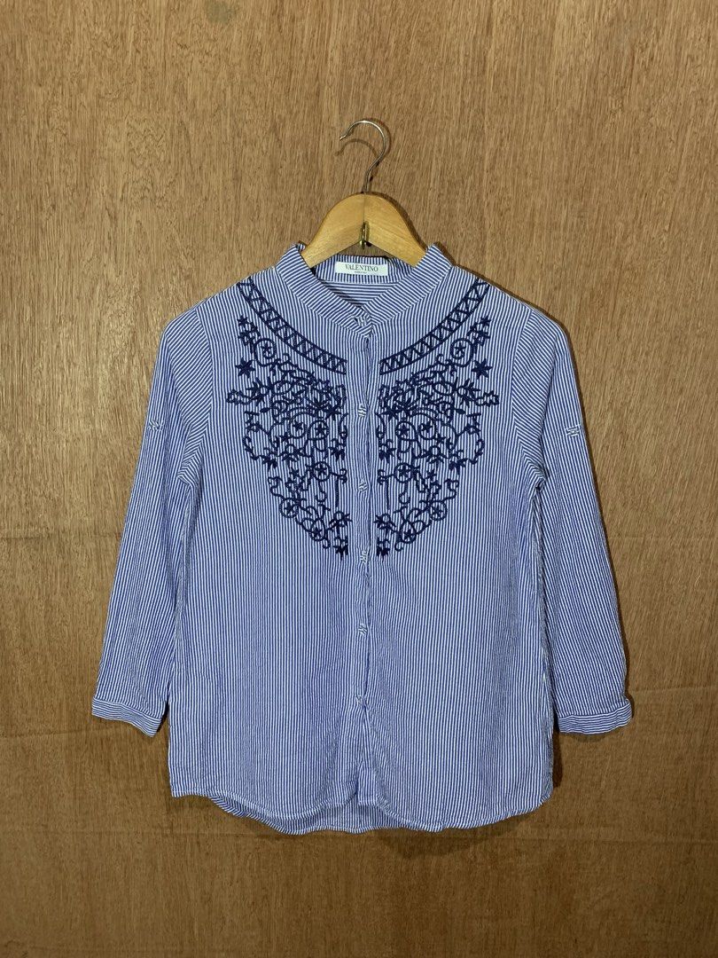 Valentino Blue Striped Embroidered Button-Down Shirt (Category: Formal Shirts) located in Tacurong. Submitted by ljsthrift (Listing ID 1467603760, Image 1). Description: - Valentino button-down shirt in blue & white stripes - Features a chic mandarin collar and intricate dark blue embroidery across the chest and neckline - Made of lightweight, premium cotton (Made in Italy, produced in Hungary) - Clean neckline label and inner care tag fully inta