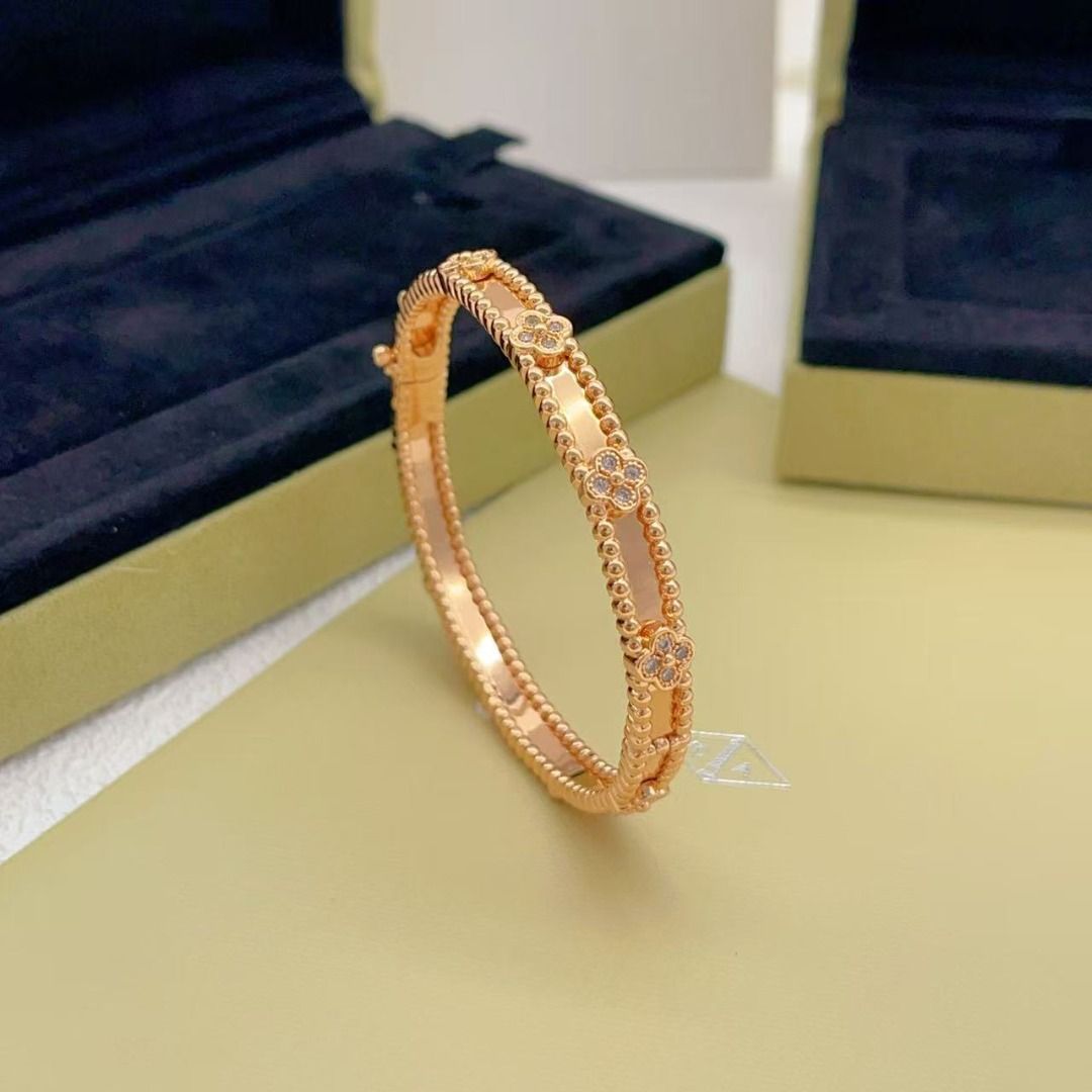 Van Cleef & Arpels Rose Gold Alhambra Bracelet (Category: Bracelets) located in Cavite. Submitted by gobangblog80903 (Listing ID 1467656658, Image 2). Description: - Brand: Van Cleef & Arpels - Metal: Rose gold - Design: Delicate clover motifs with small diamonds along a beaded band - Closure: Convenient hinged side closure - Inclusions: Complete with branded blue presentation box and outer packaging - Condition: Beautiful luxury jewelry piece, m