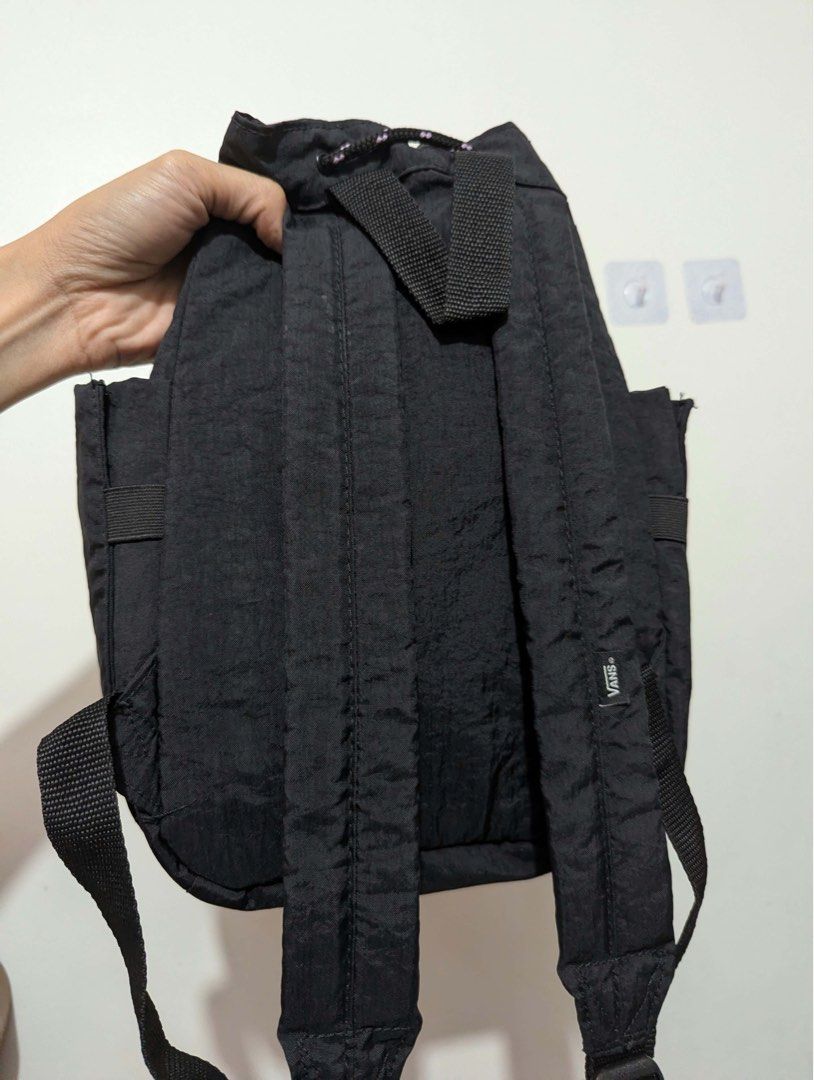 Vans Black Drawstring Backpack (Category: Backpacks) located in Quezon City. Submitted by thegoodkarmaph (Listing ID 1467721145, Image 2). Description: Black nylon backpack from Vans. Drawstring closure with patterned rope cord. Front zippered pocket features the rubberized Off The Wall patch logo. Inside has black checkered lining and a Vans woven tag. Adjustable shoulder straps in matching black webbing. Handy side slip pockets too. Great daily
