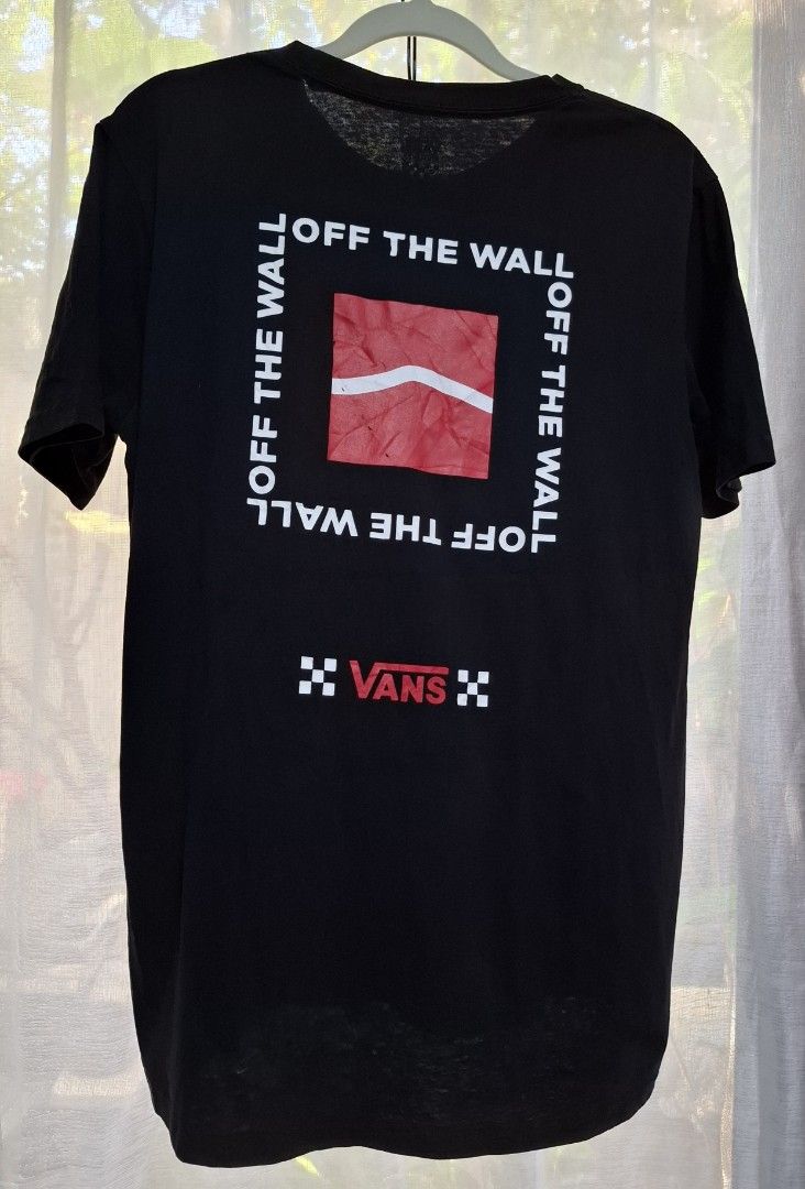 Vans Off The Wall Black T-Shirt Medium (Category: Tshirts & Polo Shirts ) located in Manila. Submitted by jazil.ladyliz (Listing ID 1467685225, Image 3). Description: - Brand: Vans - Color: Black - Size: Men's Medium (20×28) - Fit: Standard fit - Material: 100% Cotton - Design: Small red Vans logo on left chest, large 'Off The Wall' square graphic on the back - Details: Short sleeves, crew neck - Condition: Clean inside tag and inner wash care la