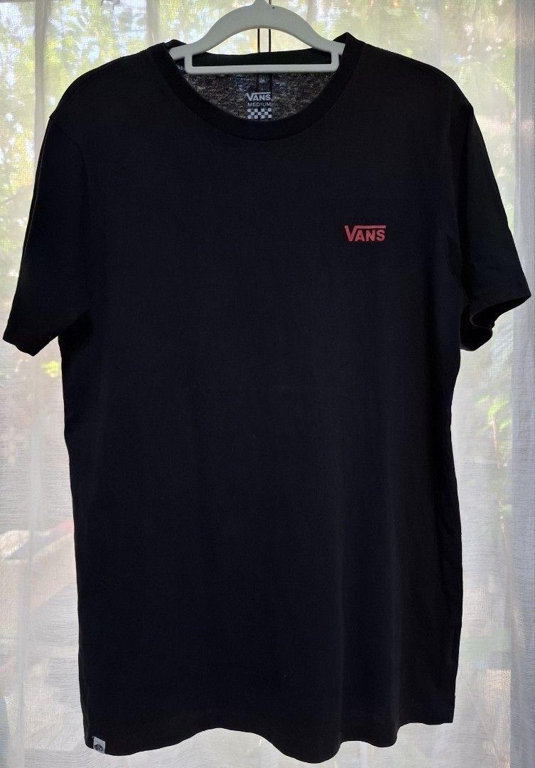 Vans Off The Wall Black T-Shirt Medium (Category: Tshirts & Polo Shirts ) located in Manila. Submitted by jazil.ladyliz (Listing ID 1467685225, Image 2). Description: - Brand: Vans - Color: Black - Size: Men's Medium (20×28) - Fit: Standard fit - Material: 100% Cotton - Design: Small red Vans logo on left chest, large 'Off The Wall' square graphic on the back - Details: Short sleeves, crew neck - Condition: Clean inside tag and inner wash care la